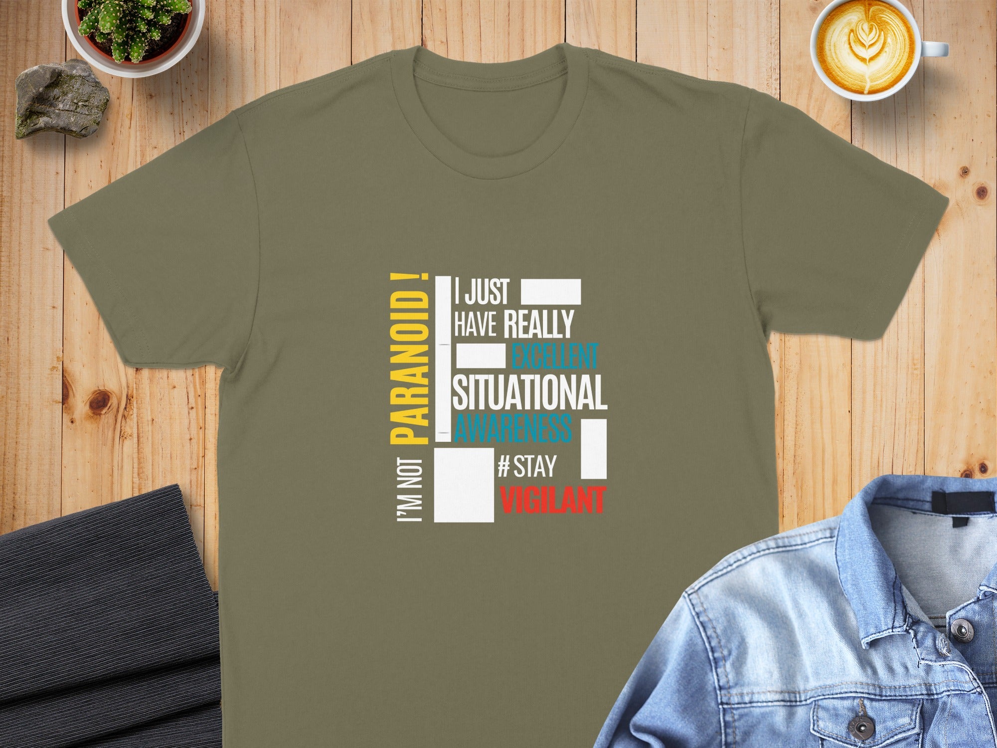 Olive green t-shirt with white and yellow text "I'm not paranoid! I just have really taken situational awareness #stayvigilant".