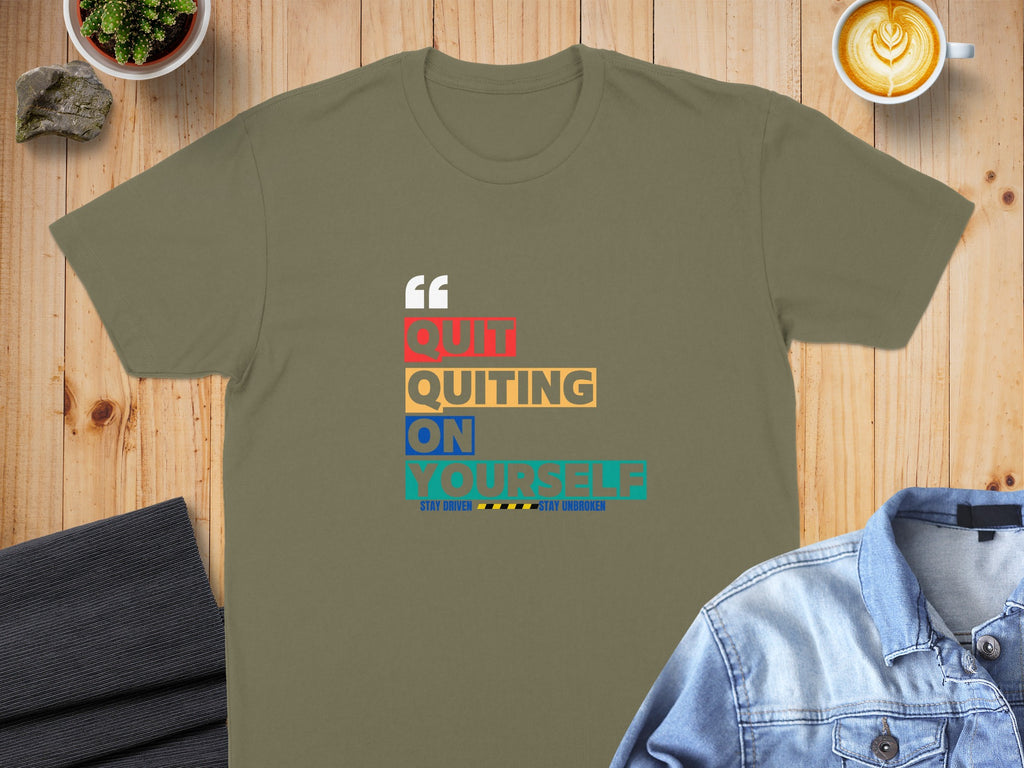 Olive green t-shirt with colorful text "QUIT QUITTING ON YOURSELF".