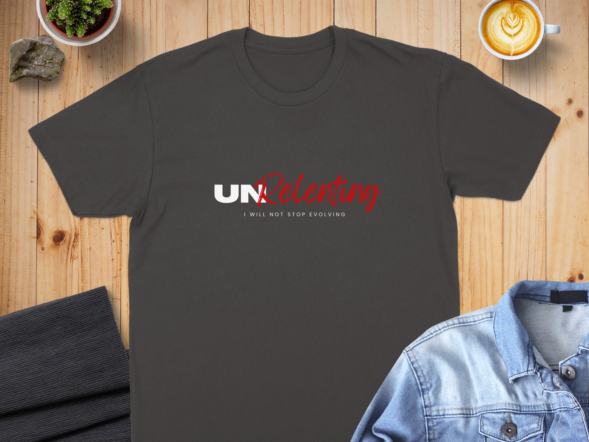 Dark grey t-shirt with red and white "UNRELENTING" text and smaller white text below.