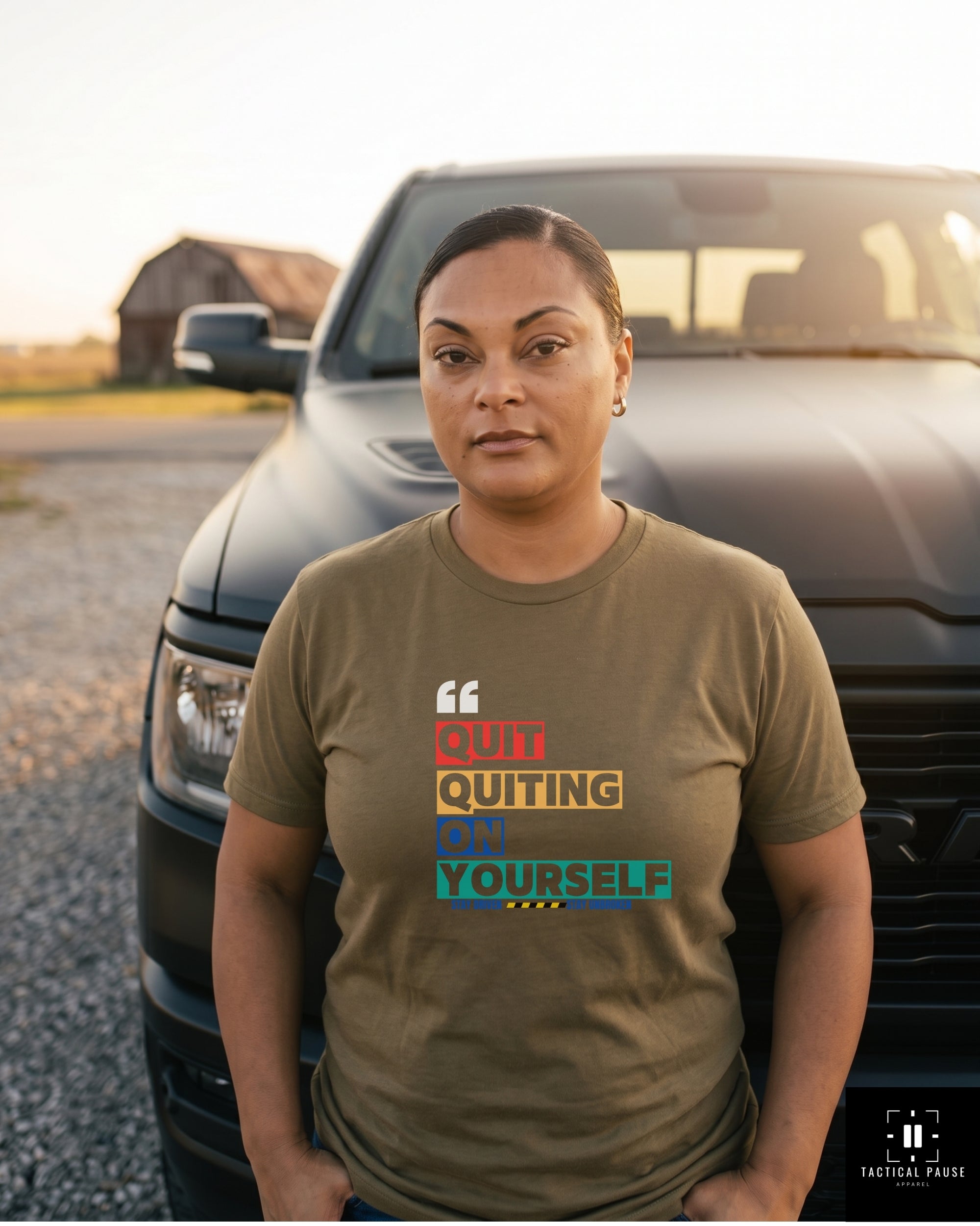 Veteran in olive green Quit Quitting on Yourself Resiliency tee standing by a truck, off-duty outdoor lifestyle — Tactical Pause Apparel