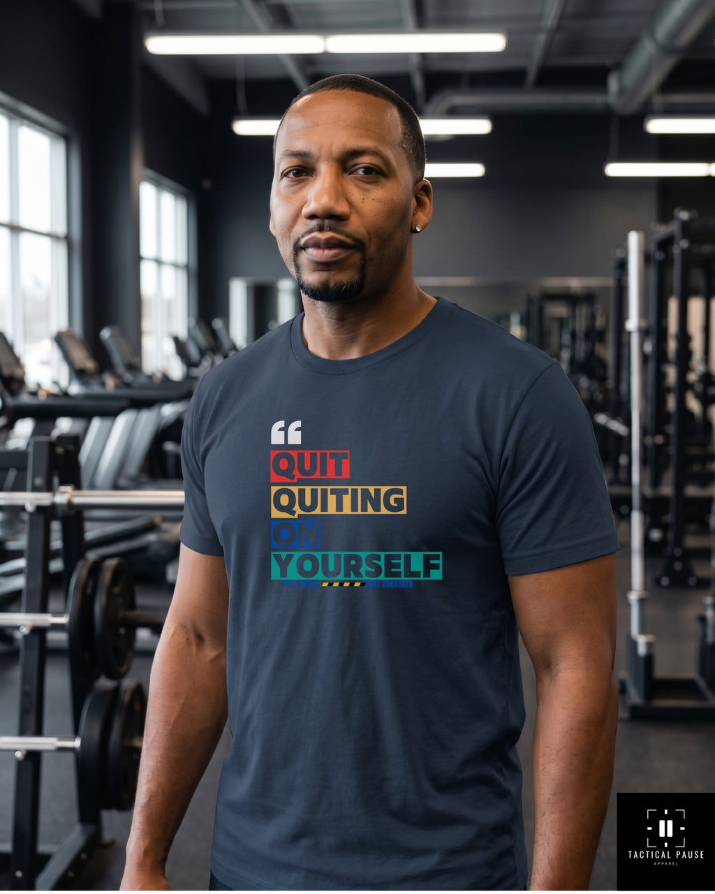 Veteran in Navy Quit Quitting on Yourself Resiliency tee standing in the gym around equipment — Tactical Pause Apparel