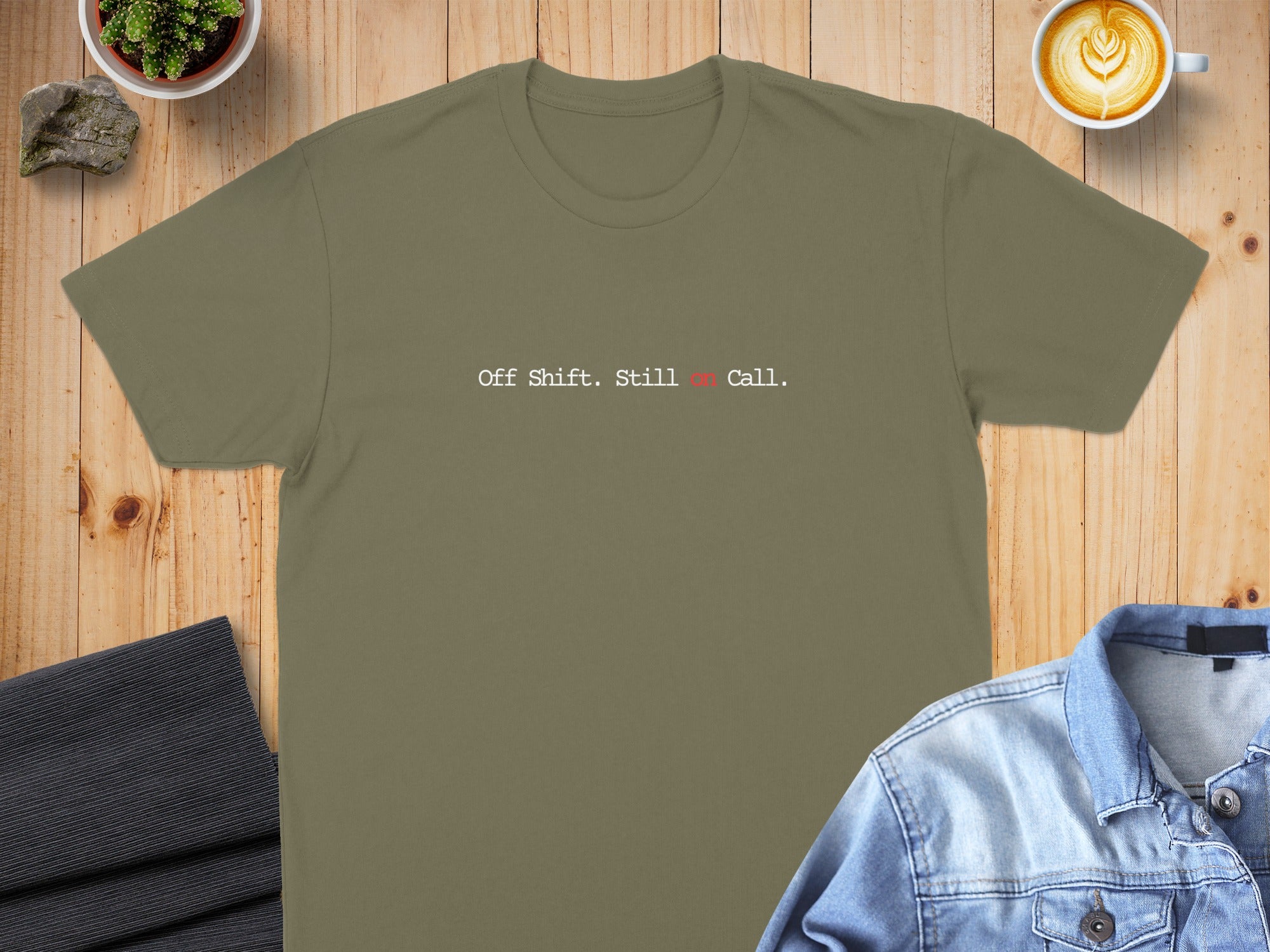 Olive green t-shirt with white text "Off Shift. Still on Call."