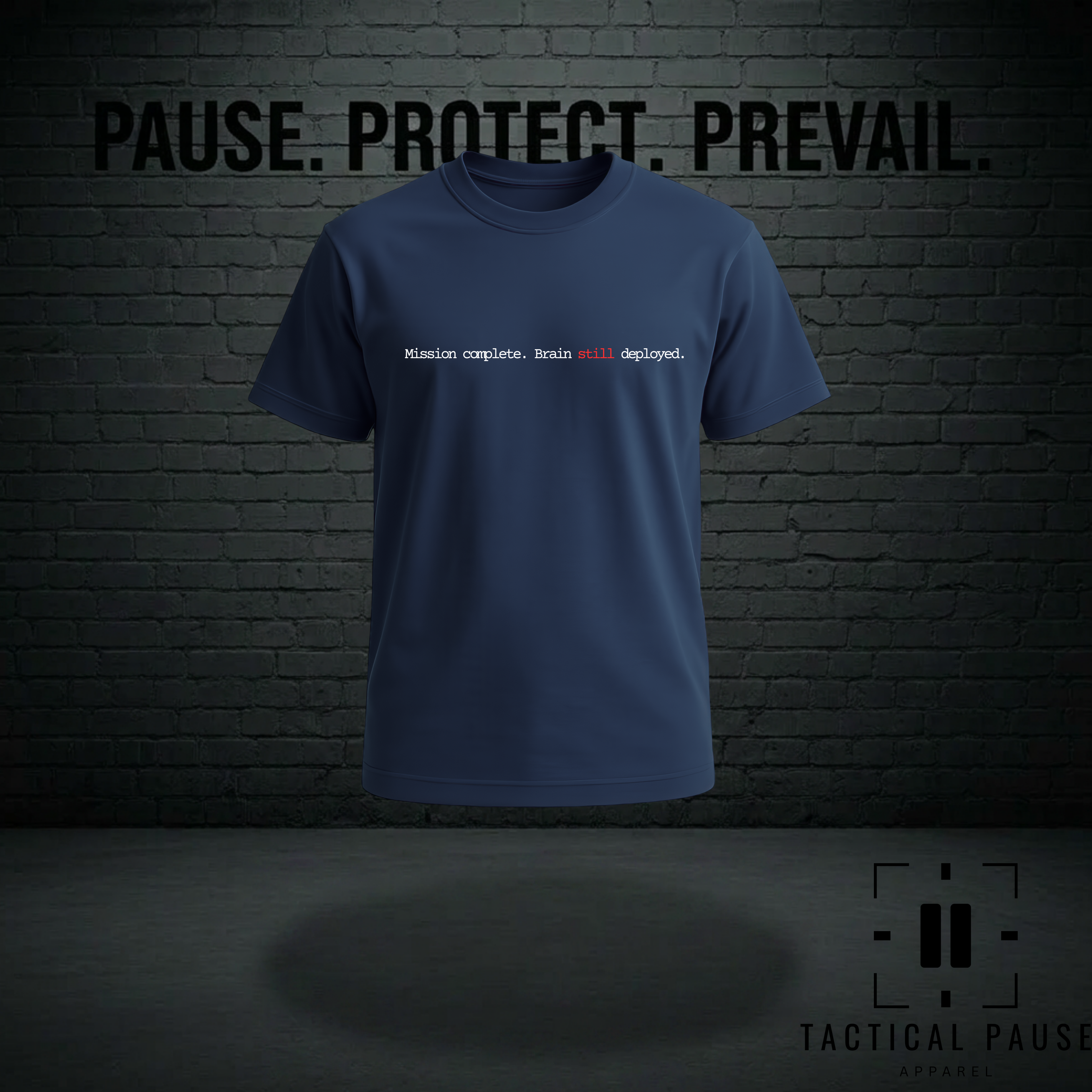 Blue t-shirt with text on a dark brick wall background. The design on the shirt is Mission complete, brain still deployed.