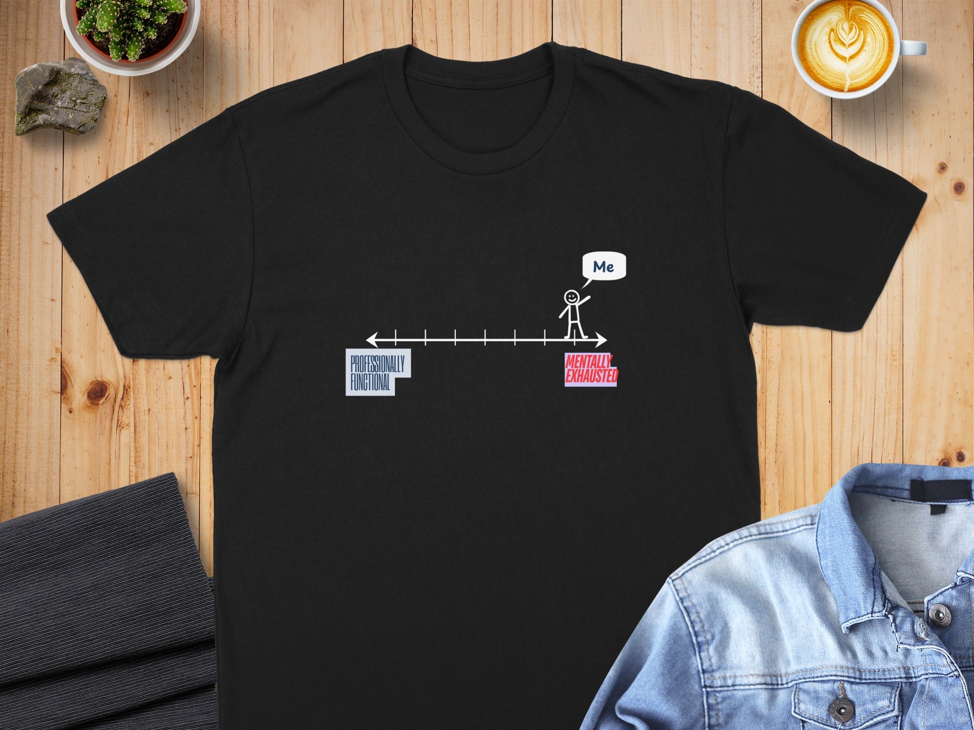 Black t-shirt with a graphic depicting a person labeled "Me" at the end of a spectrum from "Professionally Functional" to "Mentally Exhausted".