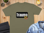 Olive t-shirt with "Trauma" text and a red and gold seal.