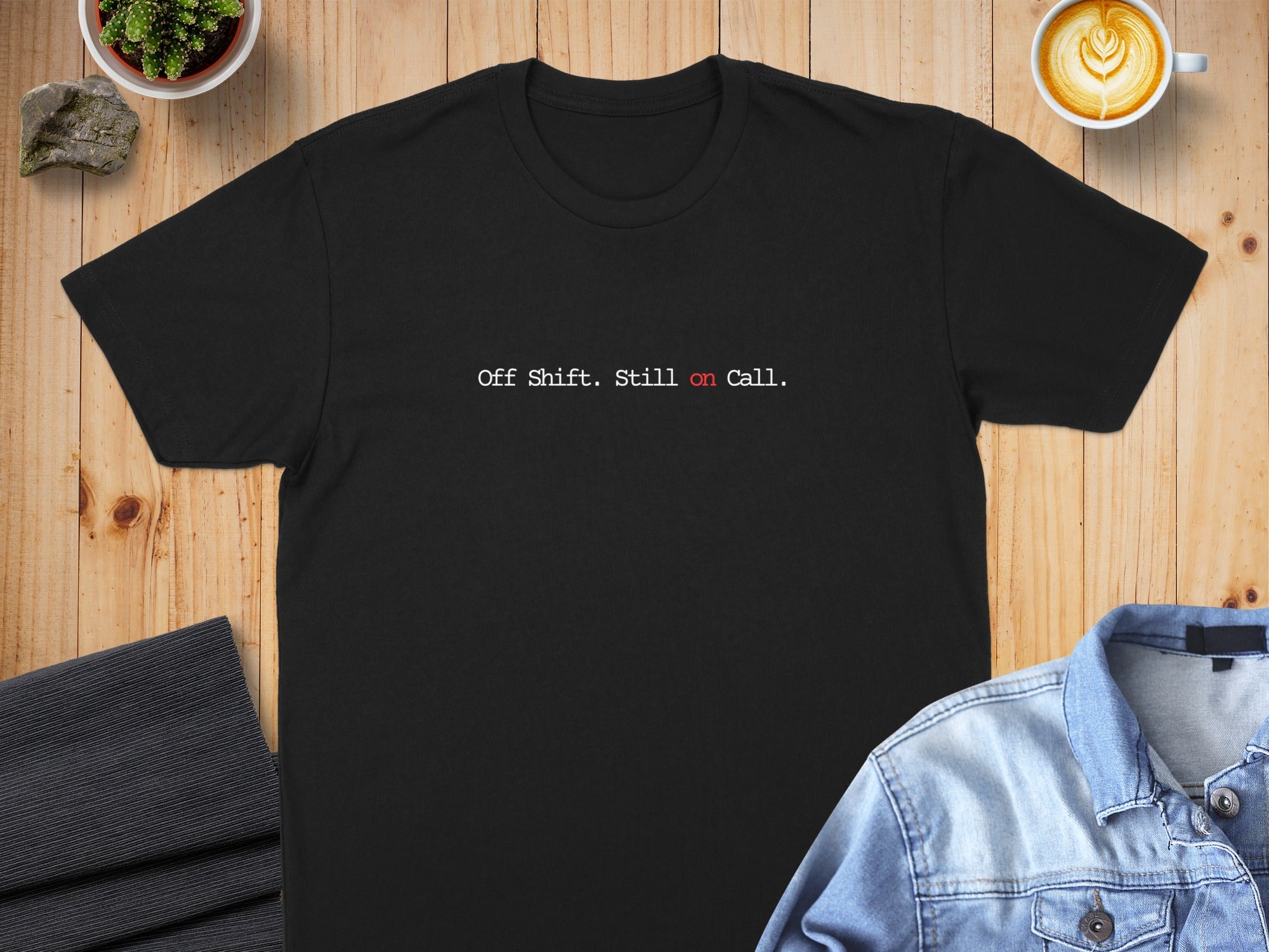 Black t-shirt with white text "Off Shift. Still on call."