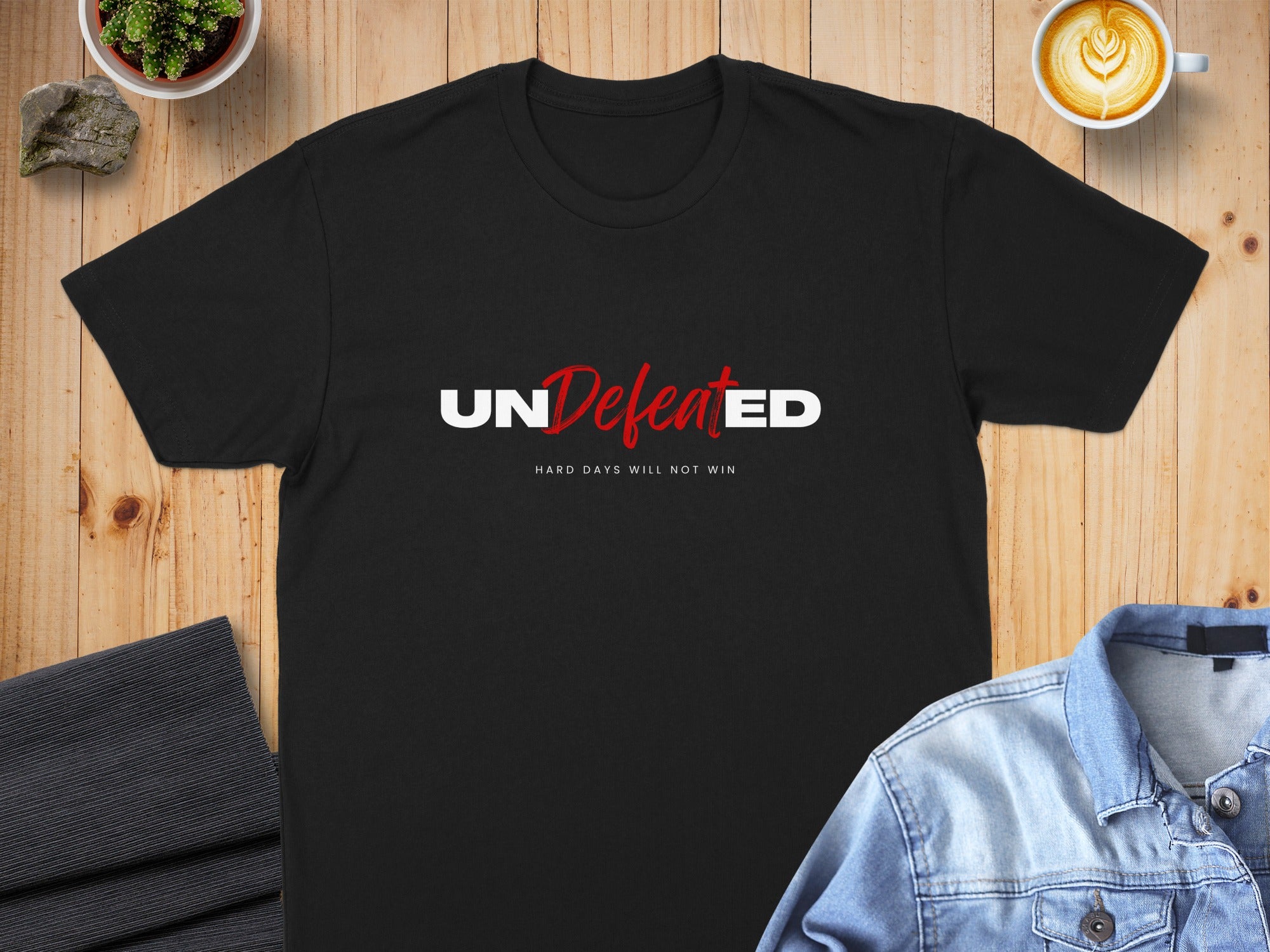 Black t-shirt with "UNDEFEATED" and "HARD DAYS WILL NOT WIN" text.